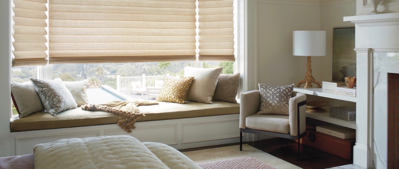 Hunter Douglas Vignette® Modern Roman Shades over window seat