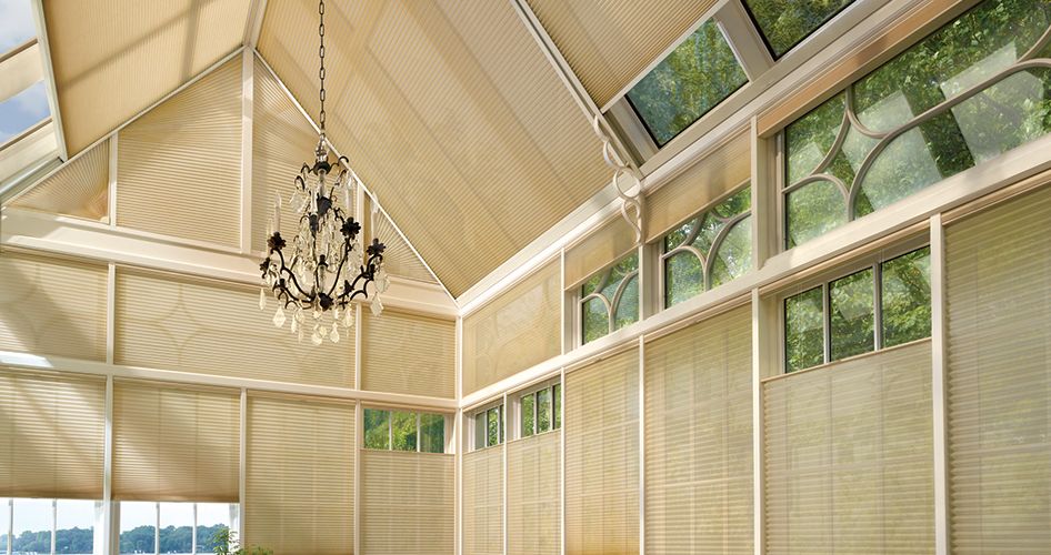 SkyLift™ Duette® Honeycomb Shades in glass room