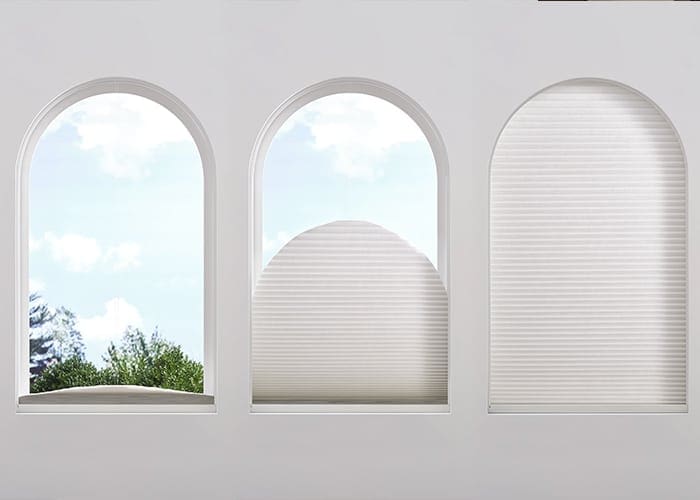 Bright arched windows with white blinds and outdoor view, creating a stylish, airy ambiance ideal for contemporary interiors.