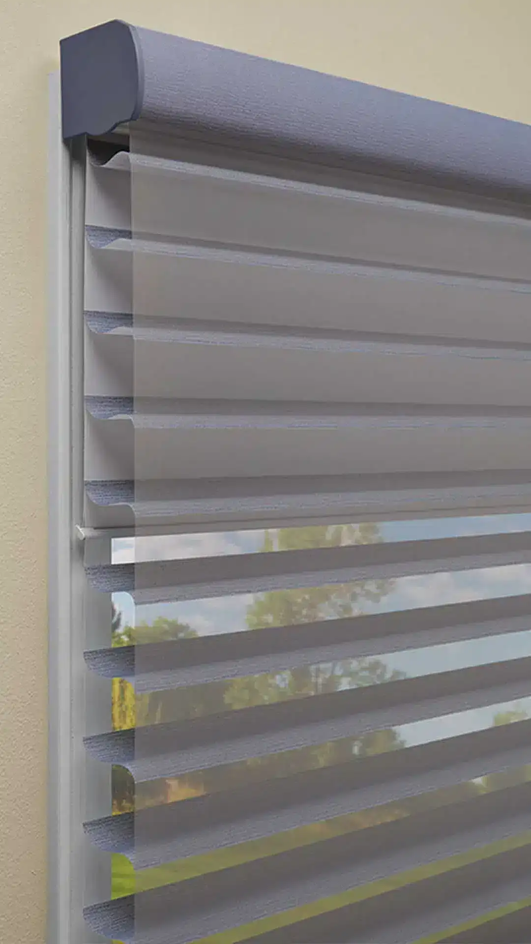 Stylish gray horizontal window blinds with adjustable slats and a sleek design, providing privacy and sunlight regulation for home or office spaces.