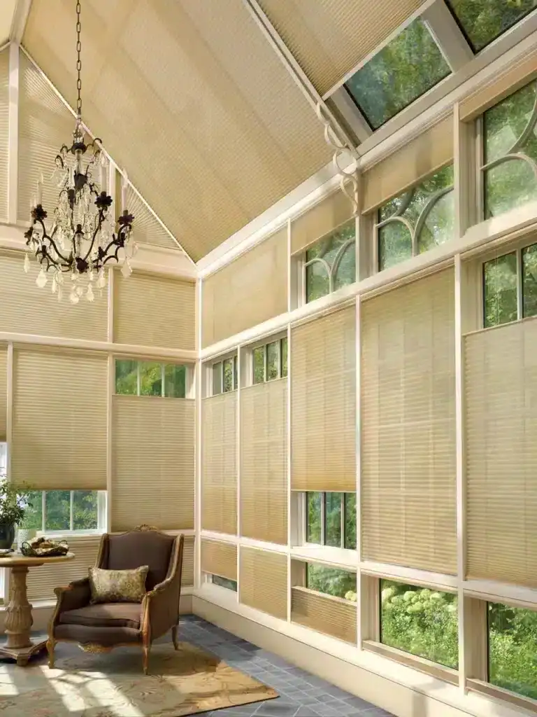 Sunroom with beige window blinds and vintage chandelier.