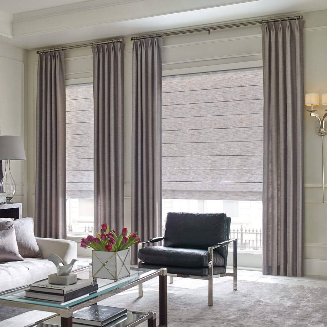 Luxurious window curtains and blinds in a modern living space.